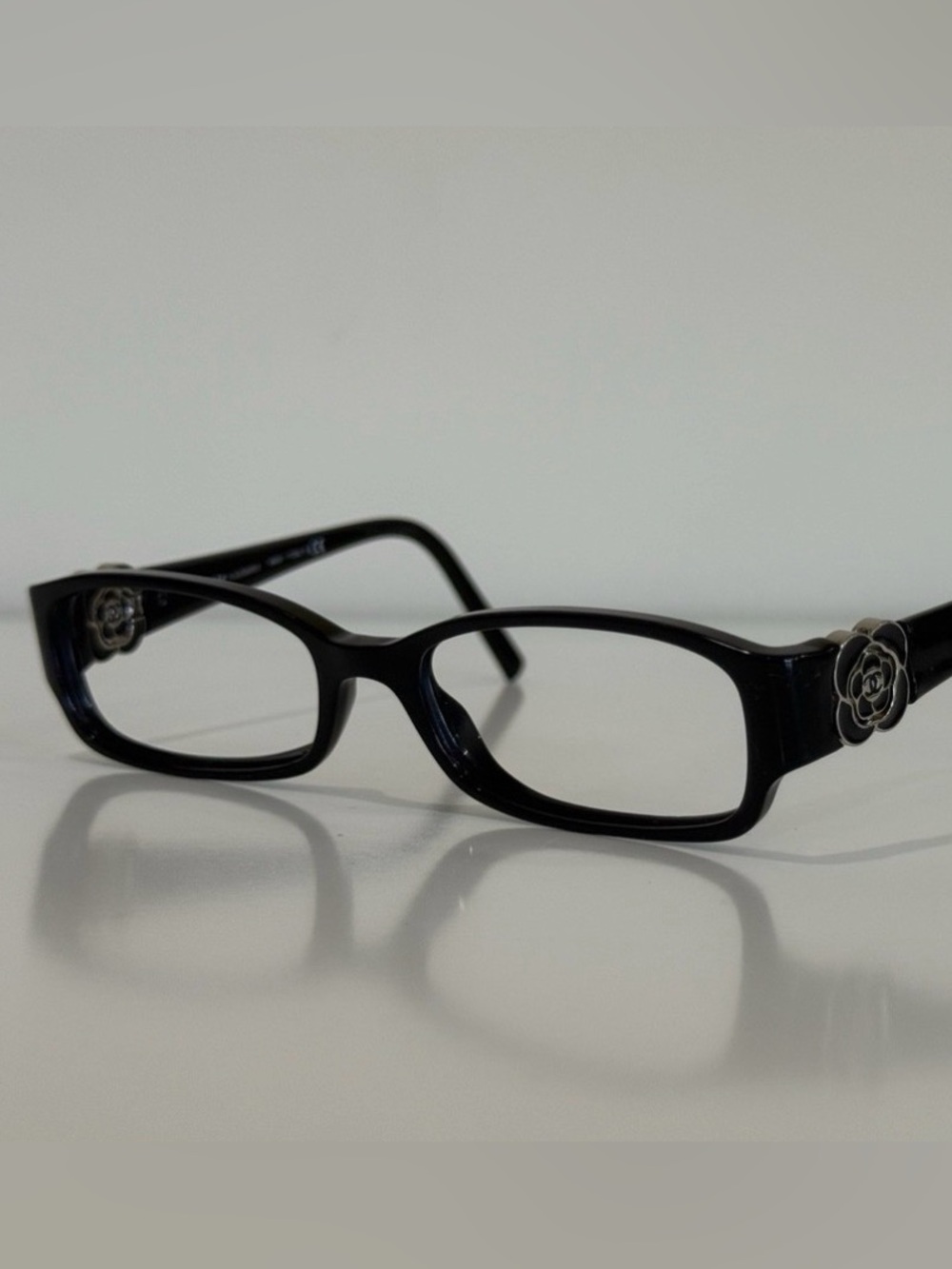CHANEL Frame Black Rectangular Glasses with Camellia Temple Accent